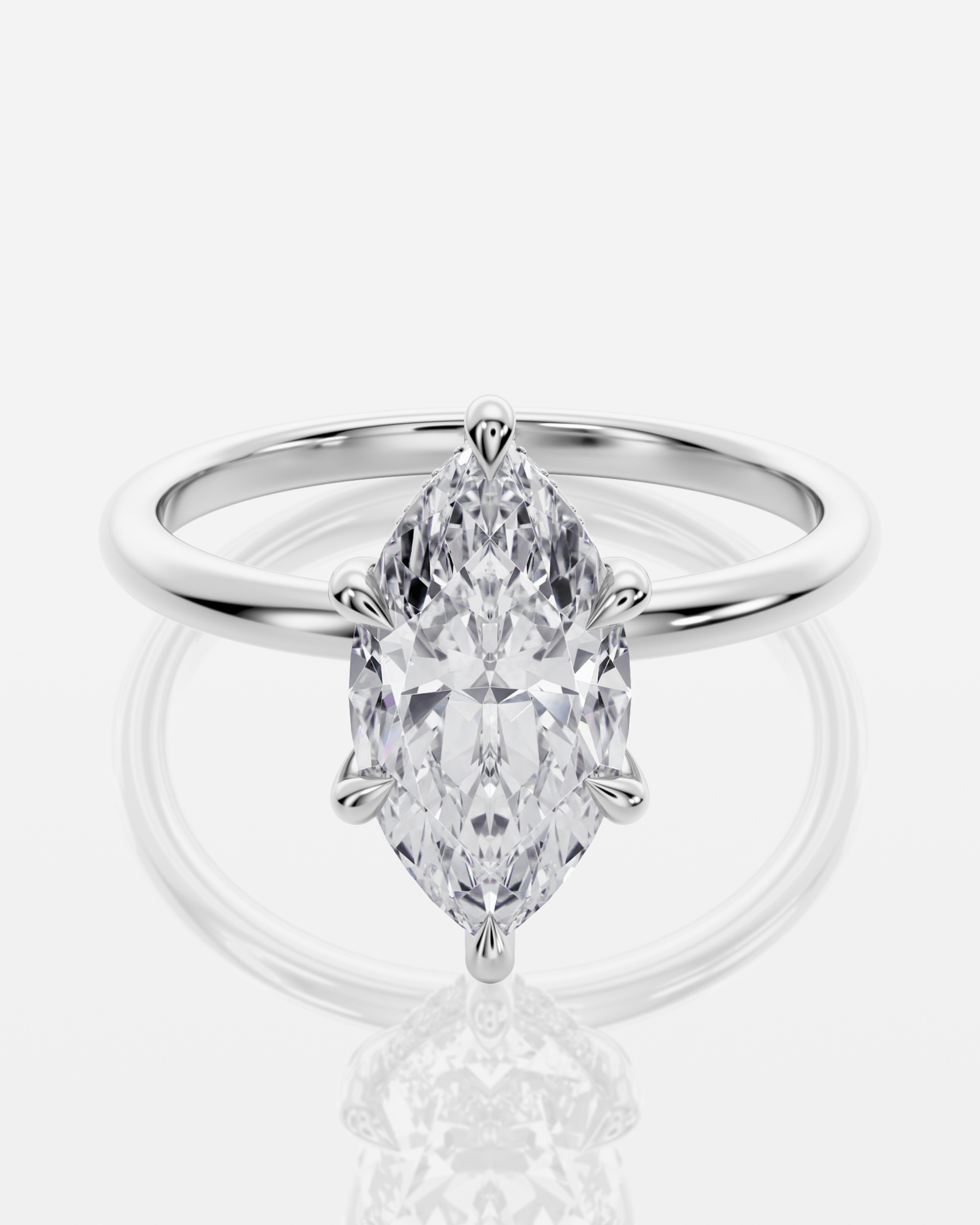 Celine Hidden Halo Marquise förlovningsring i 18K vitt guld med marquiseslipad diamant och V-klor, framifrån