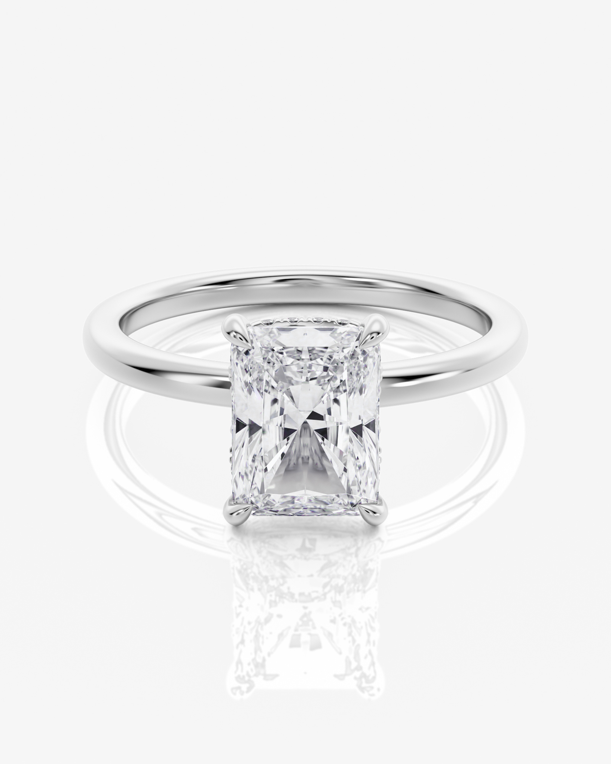 Celeste Solitär Hidden Halo Radiant förlovningsring i 18K vitt guld med radiantslipad diamant, framifrån
