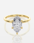 Celine Hidden Halo Marquise förlovningsring i 18K guld med marquiseslipad diamant och V-klor, framifrån