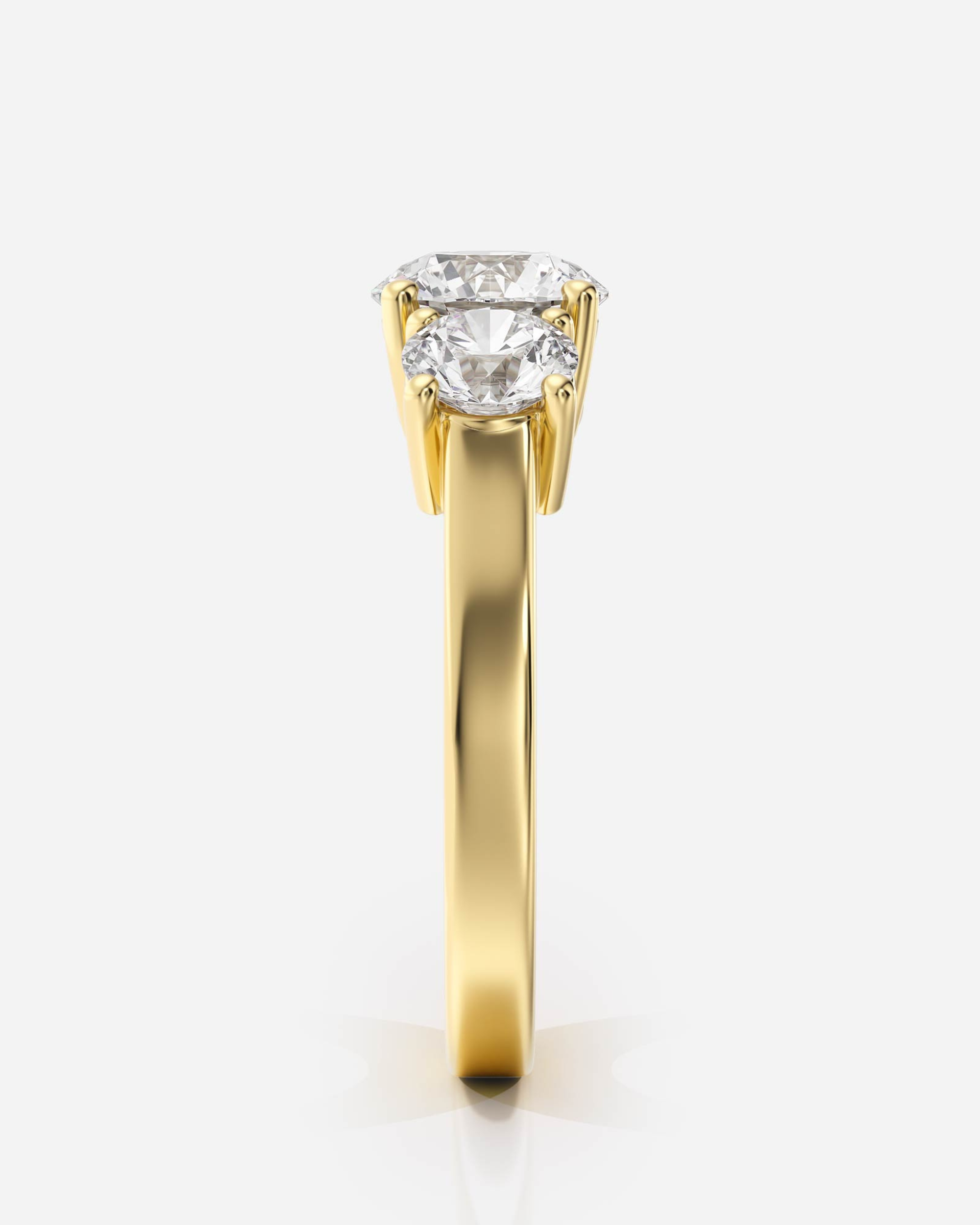 Marceline Trestensring i 18K guld, sidovy med tre rundslipade diamanter