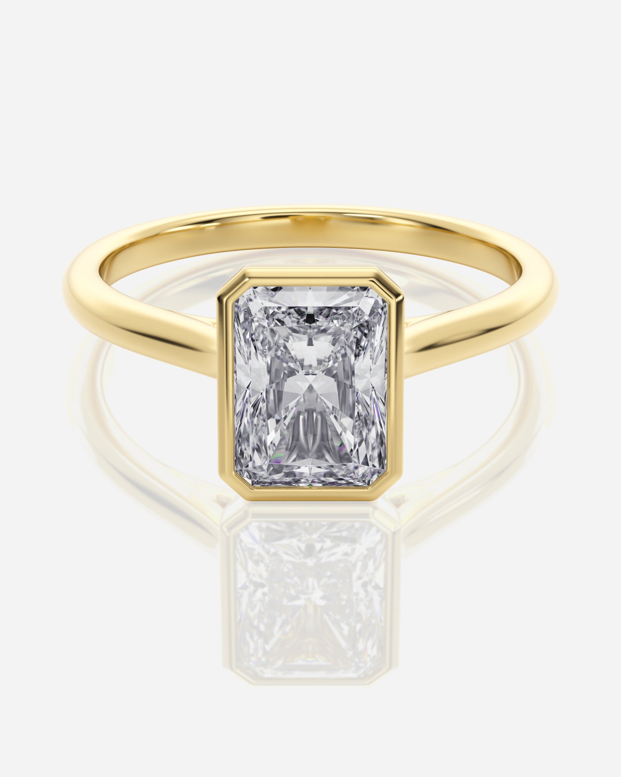 Emerald förlovningsring 18K guld bezel – Athea Basel | Ophira & Co