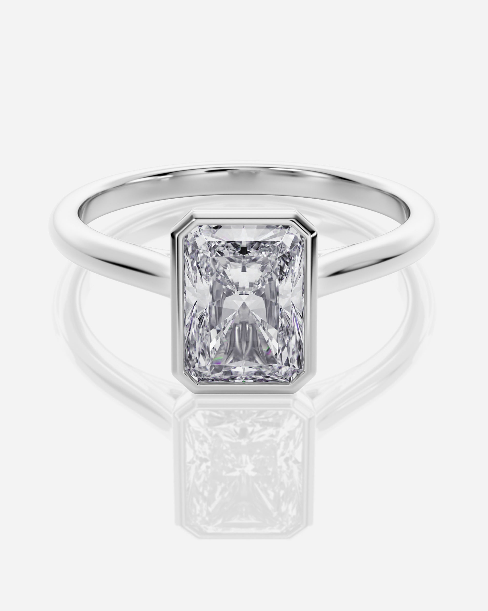 Emerald förlovningsring 18K vitt guld bezel – Athea Basel | Ophira & Co